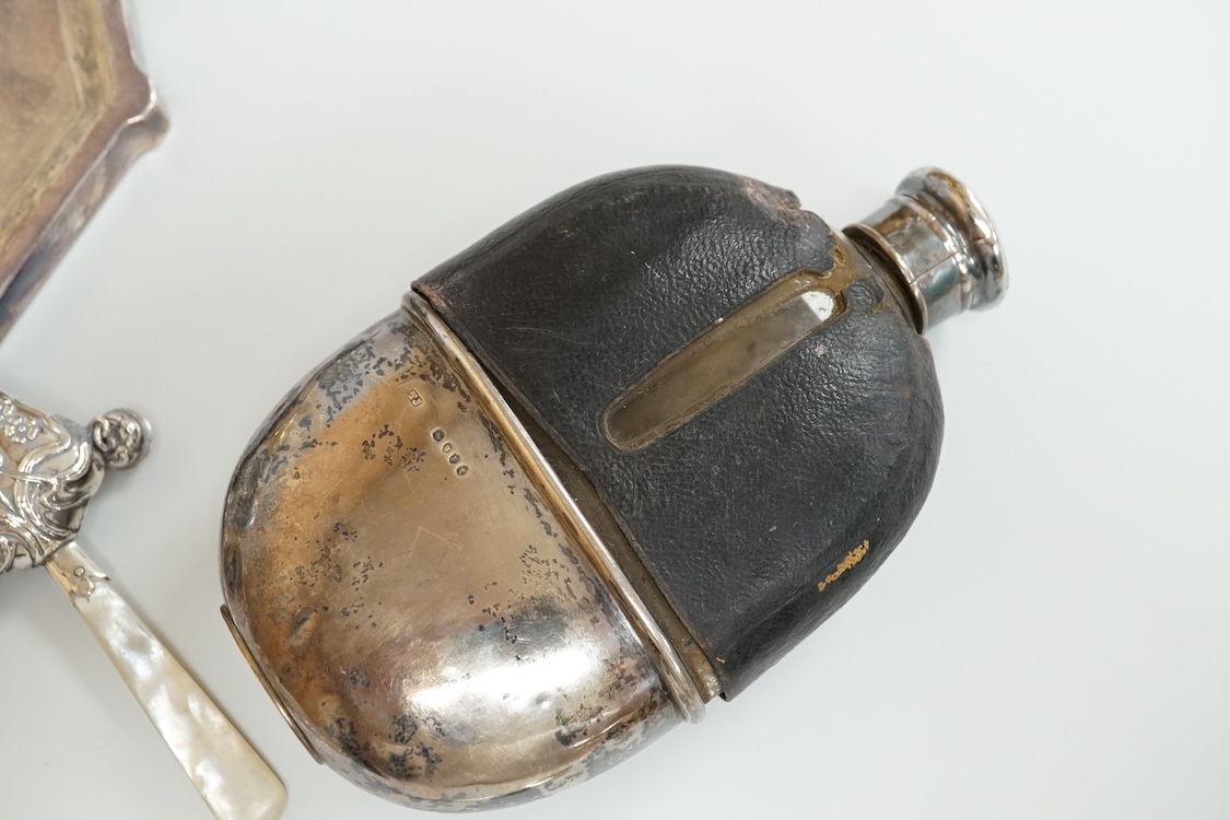 A late 19th century French small white metal Holy Water stoop, 11.4cm, together with a Victorian silver and leather mounted glass hip flask(a.f.), a late Victorian silver 'grenade' lighter by Sampson Mordan & Co, two sil